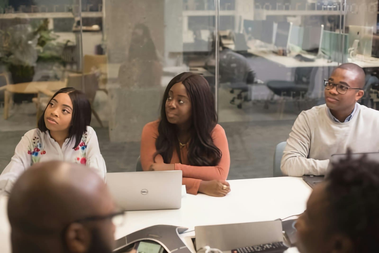 Staff members meeting around a conference table
